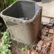 Outdoor AC unit covered in debris.